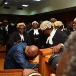 Viral video shows Emefiele hiding face in Court