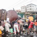 Another Tanker falls on Otedola Bridge, Residents rush out to scoop Fuel