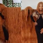 Nigerian Lady breaks Guinness World Record for the Widest Wig in the World