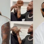 Burna Boy and D’Prince’s Mysterious Handshake Sets Social Media Abuzz